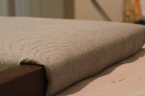 Looking to change up your headboard? Take a look at this awesome DIY Upholstered Headboard with Nailhead Trim! UpcycledTreasures.com