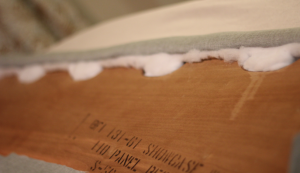 Looking to change up your headboard? Take a look at this awesome DIY Upholstered Headboard with Nailhead Trim! UpcycledTreasures.com