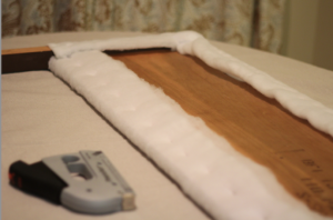 Looking to change up your headboard? Take a look at this awesome DIY Upholstered Headboard with Nailhead Trim! UpcycledTreasures.com