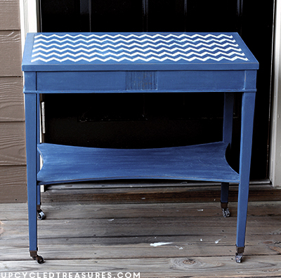 A thrifted side table gets a makeover using navy DIY chalk paint and a chevron stencil! Chevron Accent Table with DIY chalk paint. UpcycledTreasures.com