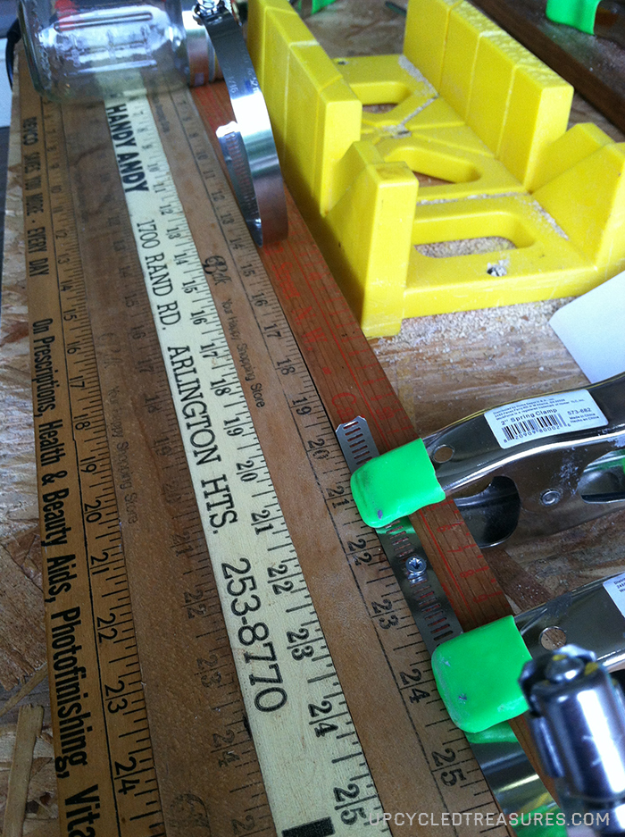 Looking for a creative storage solution? Check out how to create a mason jar wall storage using vintage yardsticks! UpcycledTreasures.com