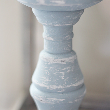DIY Distressed Pillar Candle Holders! Check out how to create distressed pillar candle holders from some wood candle holders! UpcycledTreasures.com