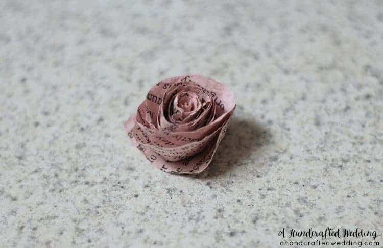 How to make Book Page Flowers for Boutonnieres. Create flowers for using dyed book pages for a vintage inspired wedding. MountainModernLife.com