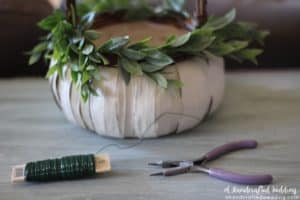 LOVE this idea for a fall wedding! Paint a pumpkin basket white, add twine and ribbon and use it for a flower girl basket. MountainModernLife.com