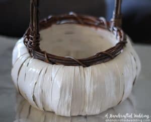 LOVE this idea for a fall wedding! Paint a pumpkin basket white, add twine and ribbon and use it for a flower girl basket. MountainModernLife.com