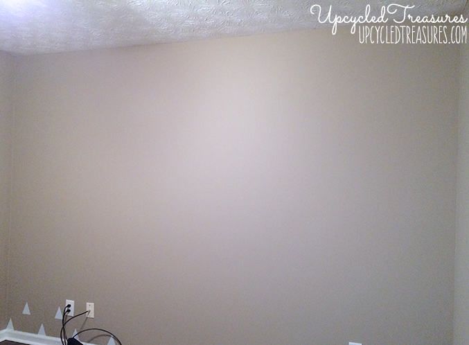 Looking to spruce up your walls in a rental property? Check out how to create a temporary DIY triangle accent wall for Less than $3! UpcycledTreasures.com