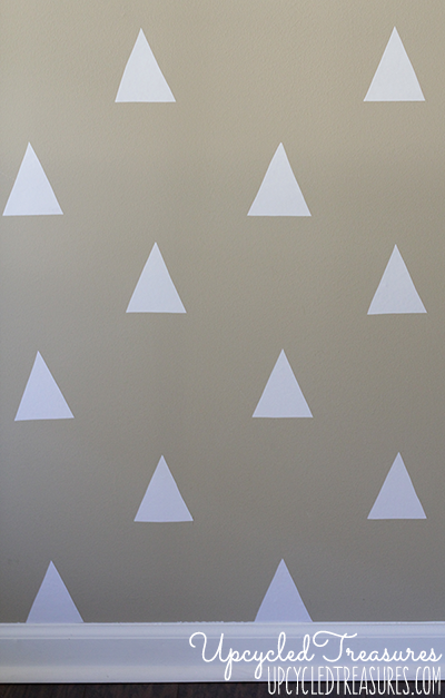 Looking to spruce up your walls in a rental property? Check out how to create a temporary DIY triangle accent wall for Less than $3! UpcycledTreasures.com