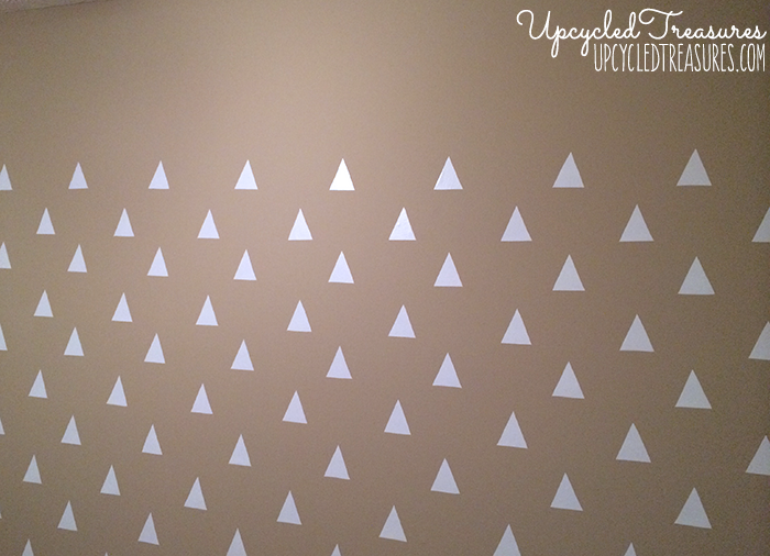 Looking to spruce up your walls in a rental property? Check out how to create a temporary DIY triangle accent wall for Less than $3! UpcycledTreasures.com