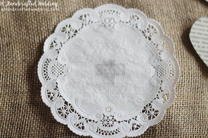 DIY Vintage Inspired Wedding Cards Banner. How to create a book page banner out of paper doilies and book pages. MountainModernLife.com