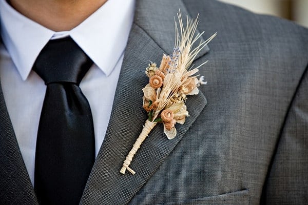 Planning a rustic, vintage, or woodland inspired wedding? Take a look at these 25 Rustic Boutonniere Ideas.