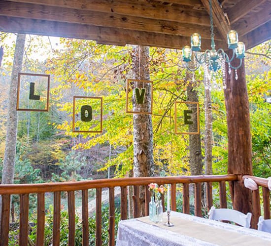 whimsical wedding decor floating mossletters at wedding reception mountainmodernlife.com