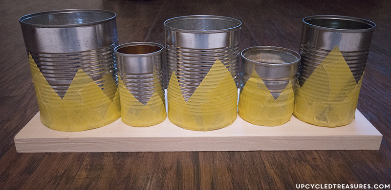 Need something cute to organize desk space, but don't have a huge budget? Check out this Upcycled Tin Can Organizer! UpcycledTreasures.com