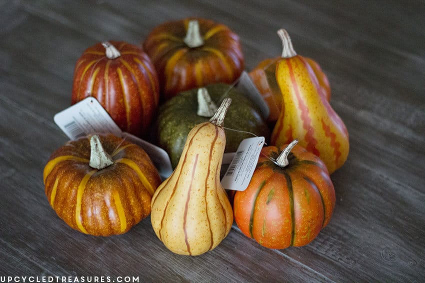 Create these adorable DIY fabric tape pumpkins by wrapping faux pumpkins with fabric tape! MountainModernLife.com