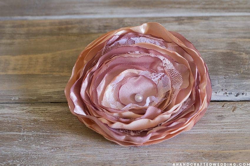 Learn how to make a fabric flower bouquet that you can cherish even after the big day, using fabric and brooches! MountainModernLife.com