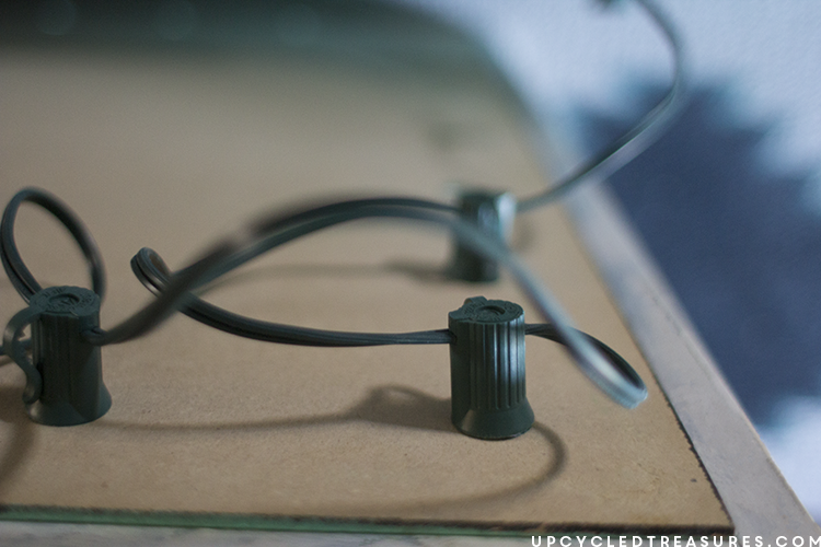 adding globe lights to an upcycled frame - upcycledtreasures