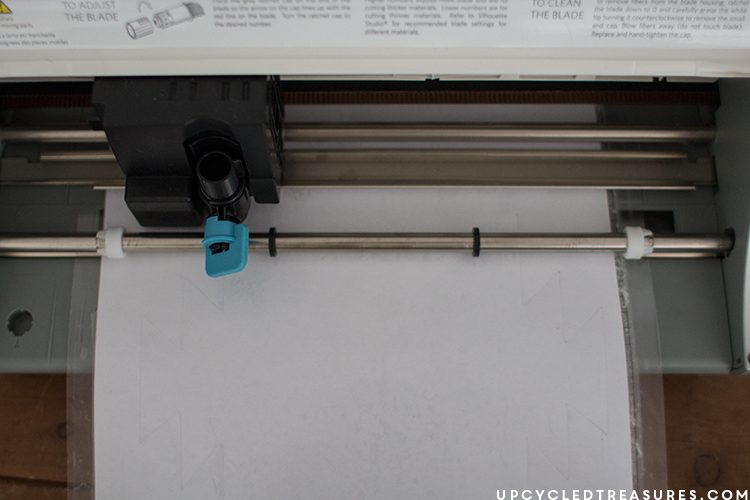 Silhouette in action cutting stencil. MountainModernLife.com