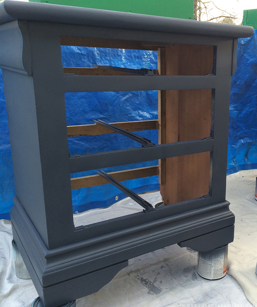 nightstand on paint cans in the middle of being painted. MountainModernLife.com