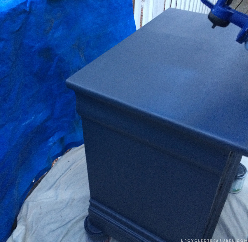 nightstand on paint cans in the middle of being painted. MountainModernLife.com