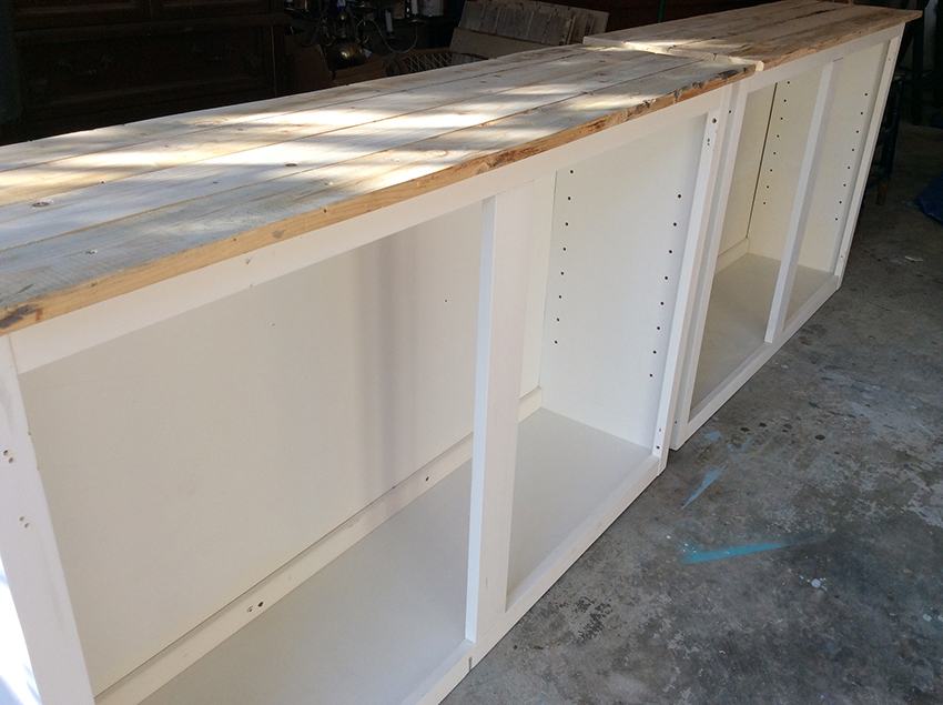 How to upcycle trash into treasure! See how a thrown out cabinet is transformed into an upcycled barnwood style sideboard. MountainModernLife.com