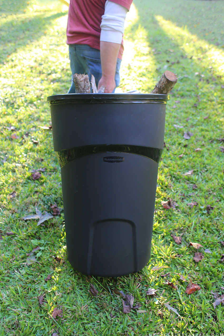 Using trash can to clean up yard and organize scrap wood. MountainModernLife.com
