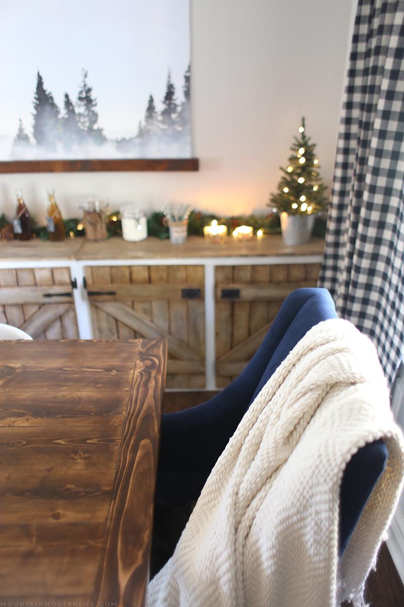 Come see how we created a cozy vibe for the holidays with our dining room Christmas decor! MountainModernLife.com
