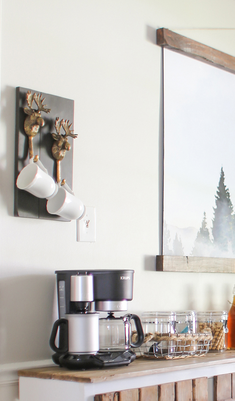 See how easy it is to make this rustic mug holder using moose hooks, perfect for a coffee bar! MountainModernLife.com