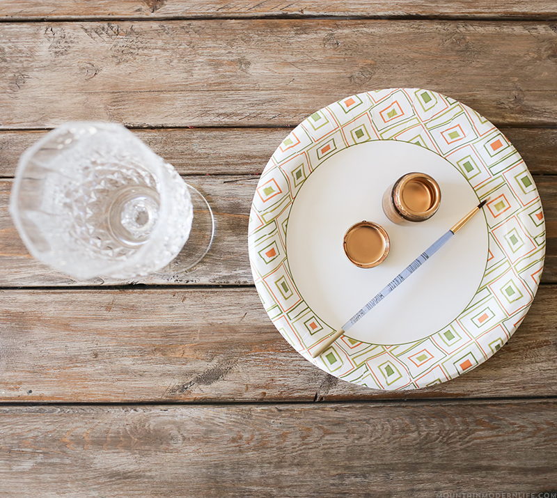 See how easy it is to create these DIY gilded glasses using stemware you may already have on hand and some liquid leaf! MountainModernLife.com