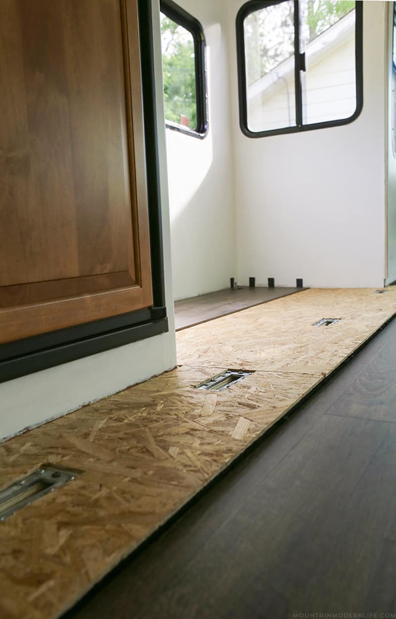 Planning to replace the flooring in your RV or camper? After some trial and error we are sharing some tips to replace the flooring Inside a RV slide out | MountainModernLife.com