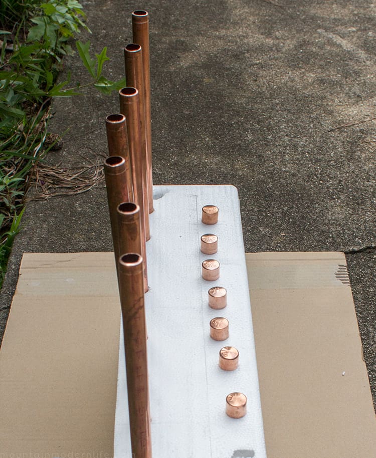 Looking to create shelves with little to no tools? See how you can easily create these Rustic Modern Shelves using pipes! MountainModernLife.com