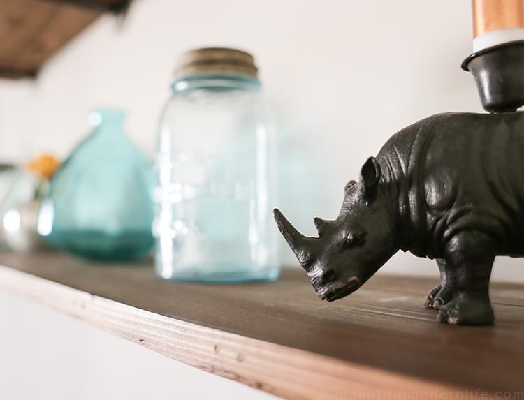 Looking to create shelves with little to no tools? See how you can easily create these Rustic Modern Shelves using pipes! MountainModernLife.com