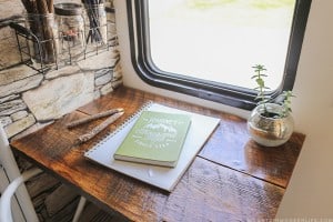 See how we added character and function to our RV by creating a wall-mounted desk from reclaimed wood. MountainModernLife.com