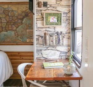 See how we added character and function to our RV by creating a wall-mounted desk from reclaimed wood. MountainModernLife.com