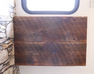 See how we added character and function to our RV by creating a wall-mounted desk from reclaimed wood. MountainModernLife.com