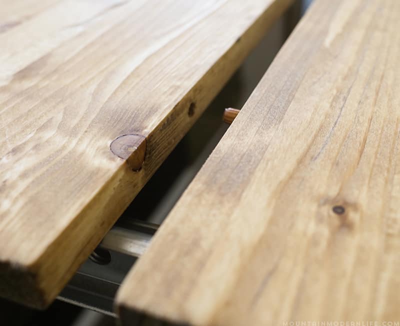 Using wooden dowels to lock table leaf extensions together