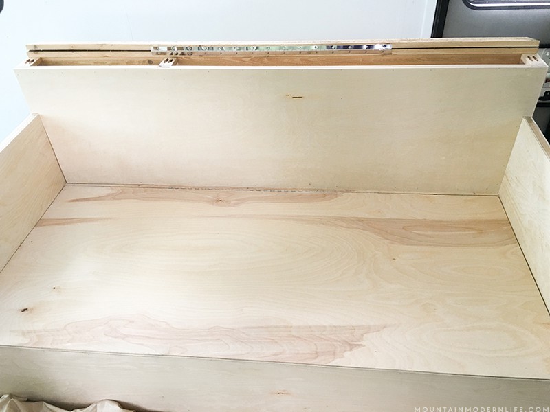Looking to build a custom seating inside your RV or camper? Come see how we created a custom RV sofa with additional storage space! MountainModernLife.com