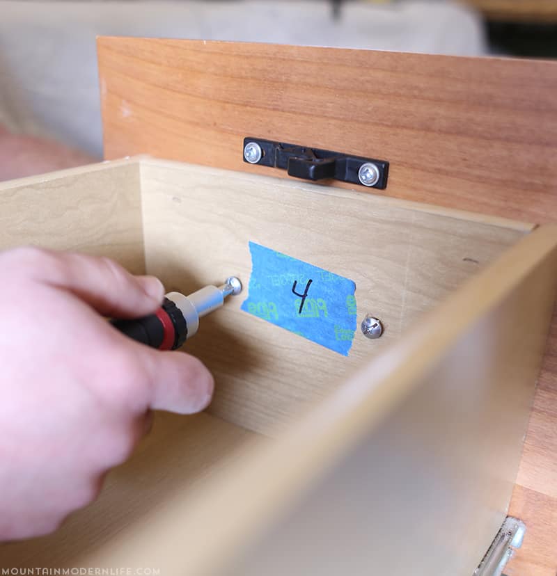 labeling-drawers-before-painting-mountainmodernlife-com Planning to paint your tiny kitchen and considering using black or the two-tone look? Come see our painted RV kitchen cabinets, and the mistakes I made along the way. MountainModernLife.com