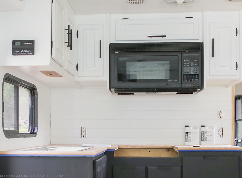 Looking for a natural wood sealer for your counters? See how we protected our RV kitchen countertops using Tung Oil which is food safe and water resistant! MountainModernLife.com