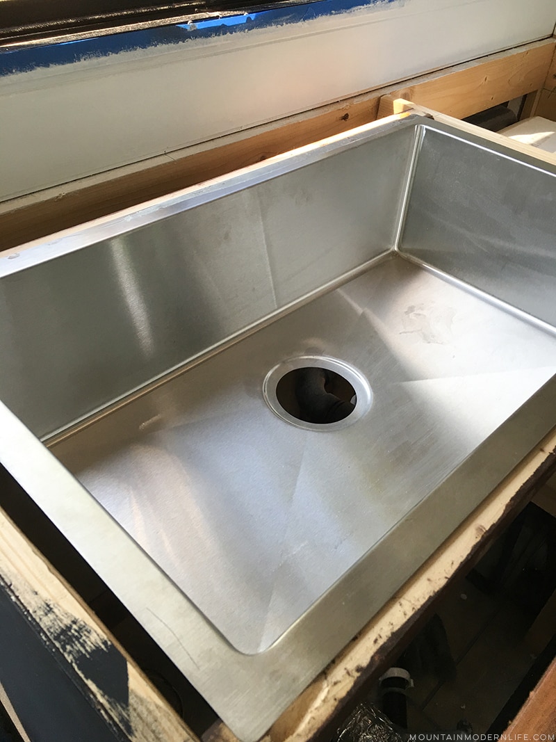 installing-braces-for-rv-kitchen-sink-mountainmodernlife.com Looking for an affordable way to update your kitchen counters? Check out this post on how to Create Wood Counters from Flooring in a RV! MountainModernLife.com