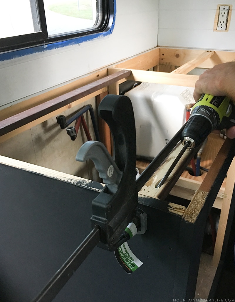 installing-braces-in-kitchen-for-countertops-mountainmodernlife.com Looking for an affordable way to update your kitchen counters? Check out this post on how to Create Wood Counters from Flooring in a RV! MountainModernLife.com