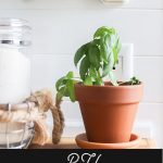 Easily install a wood planked kitchen backsplash in a RV! This is the perfect way to add rustic modern or farmhouse style to your tiny home on wheels!