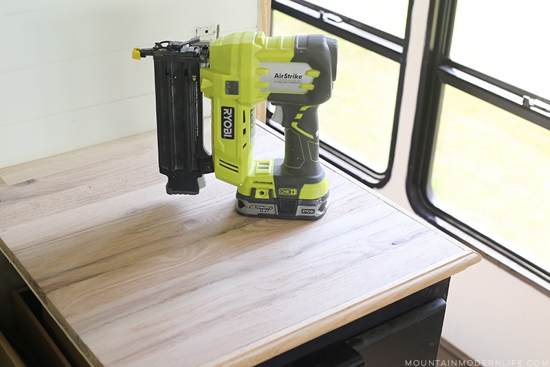 Looking for a natural wood sealer for your counters? See how we protected our RV kitchen countertops using Tung Oil which is food safe and water resistant! MountainModernLife.com