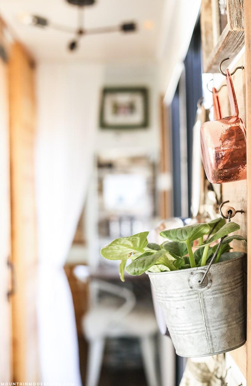 hanging-storage-in-rv-mountainmodernlife.com Could you live in less than 300 square feet? See how this outdated motorhome was completely transformed into a rustic modern RV! MountainModernLife.com