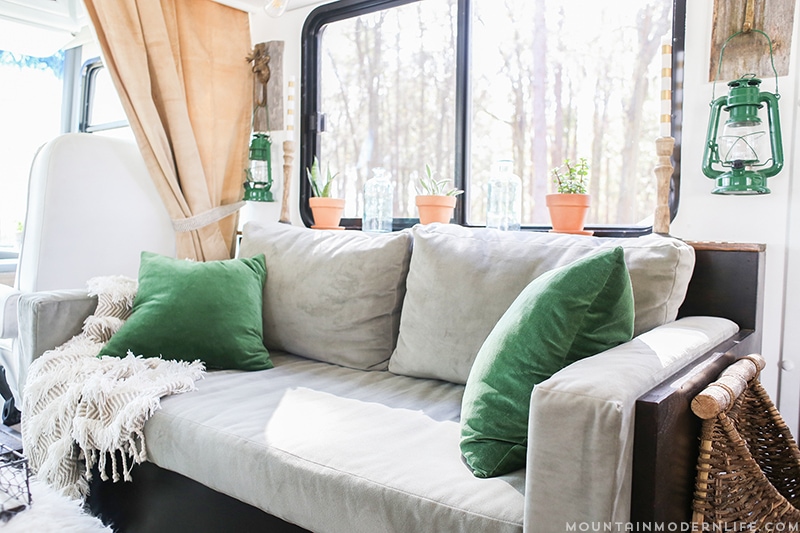 renovated-rv-with-diy-sofa-mountainmodernlife.com Could you live in less than 300 square feet? See how this outdated motorhome was completely transformed into a rustic modern RV! MountainModernLife.com