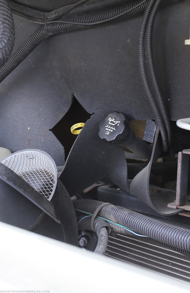 oil-cap-and-dipstick-back-in-place-changing-the-oil-in-our-gas-rv-mountainmodernlife.com change oil in RV