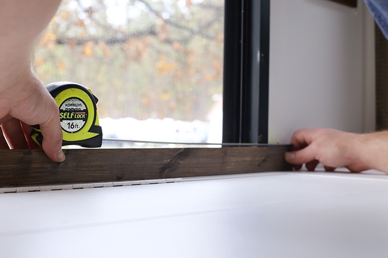 Come see how easy it is to frame RV windows to create a cozier vibe inside your tiny home on wheels! MountainModernLife.com