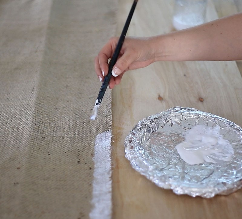 adding mod podge to edges of burlap roller shades