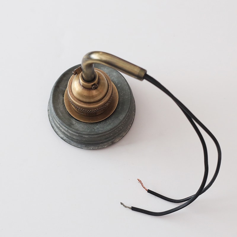 See how easy it is to make a Mason Jar wall light fixture with a dimmer switch, perfect for adding a rustic touch to your home or RV! MountainModernLife.com