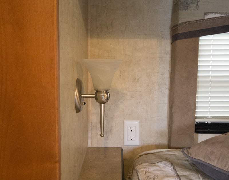 See how easy it is to make a Mason Jar wall light fixture with a dimmer switch, perfect for adding a rustic touch to your home or RV! MountainModernLife.com