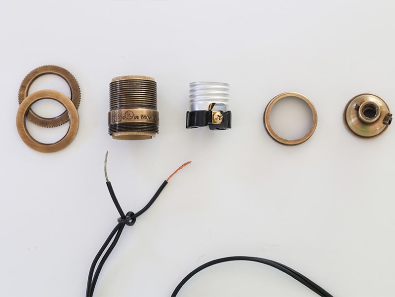 See how easy it is to make a Mason Jar wall light fixture with a dimmer switch, perfect for adding a rustic touch to your home or RV! MountainModernLife.com