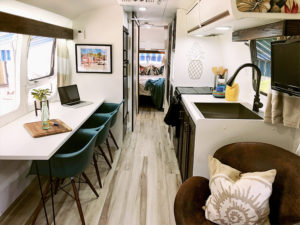 Tour this Renovated Airstream from Trailer Trashin' with Modern Finishes and Tropical Vibes! Featured on MountainModernLife.com